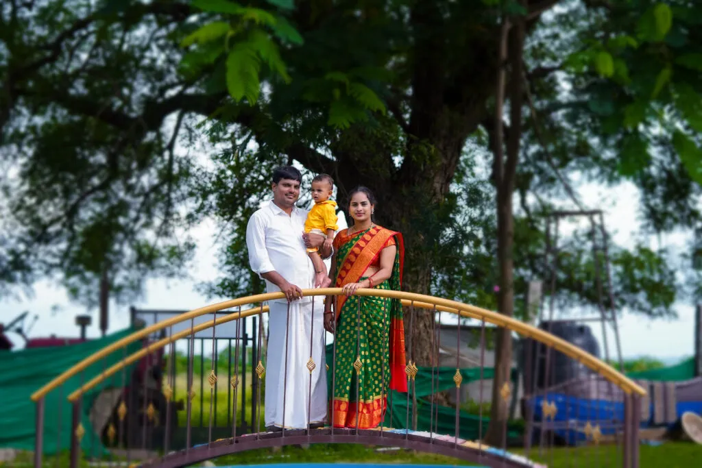 Scenic family photoshoot in Hyderabad on rustic wooden bridge.
