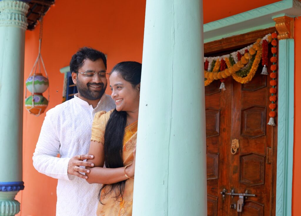 Couple photoshoot in Hyderabad verandah pillars wooden door backdrop